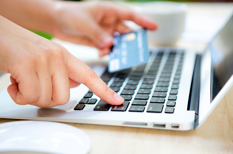 Customer using a credit card for an online purchase