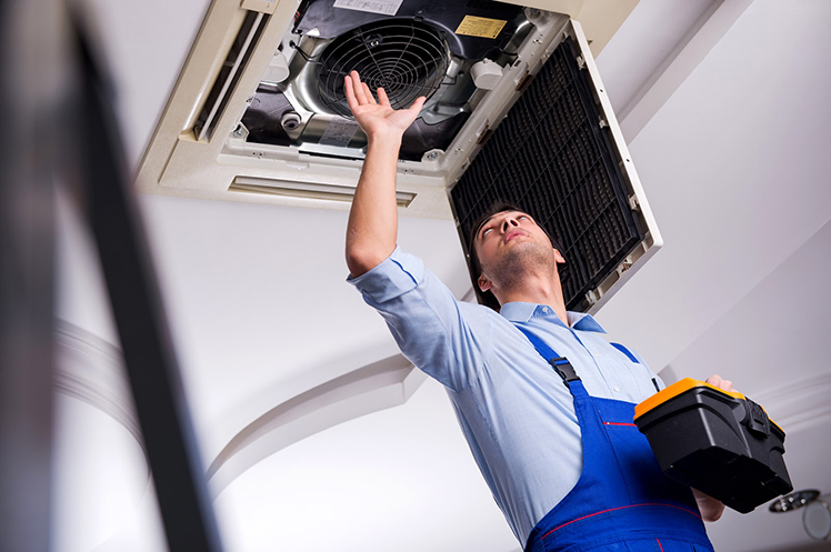 HVAC contractor inspecting installed HVAC