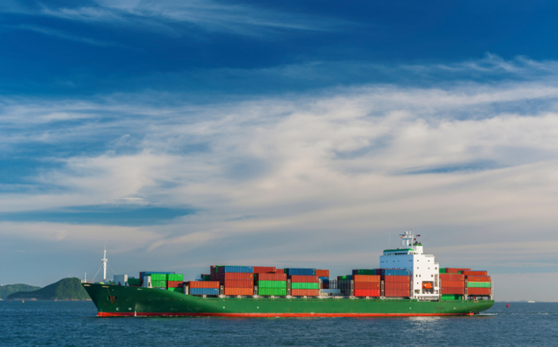 Overhead view of a freight ship depositing cargo