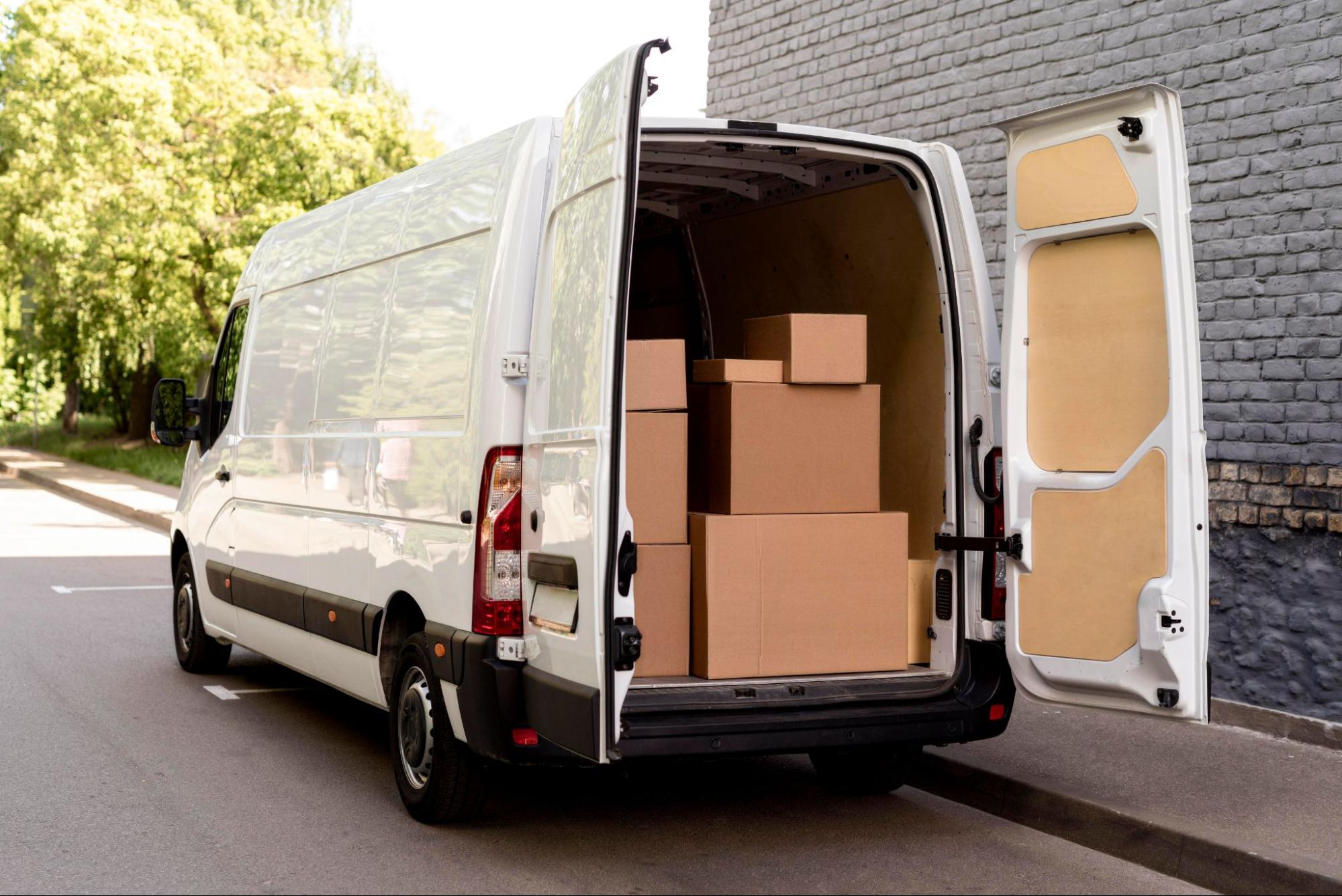 A delivery van with the backdoor open to show boxes inside