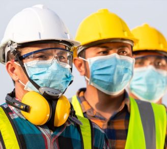 Workers wearing various PPE