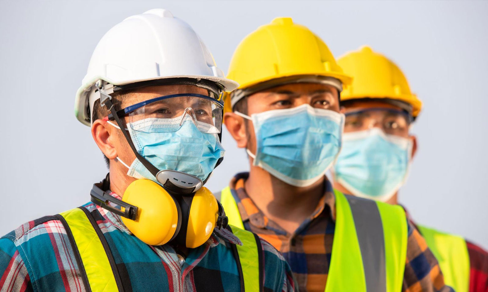 Workers wearing various PPE