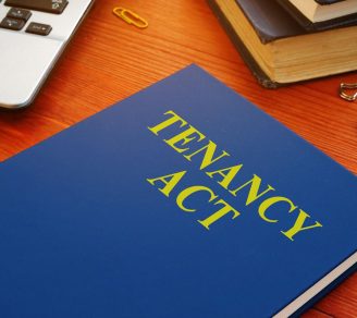 A blue book with the word “Tenancy Act” to represent the Ontario residential tenancies act