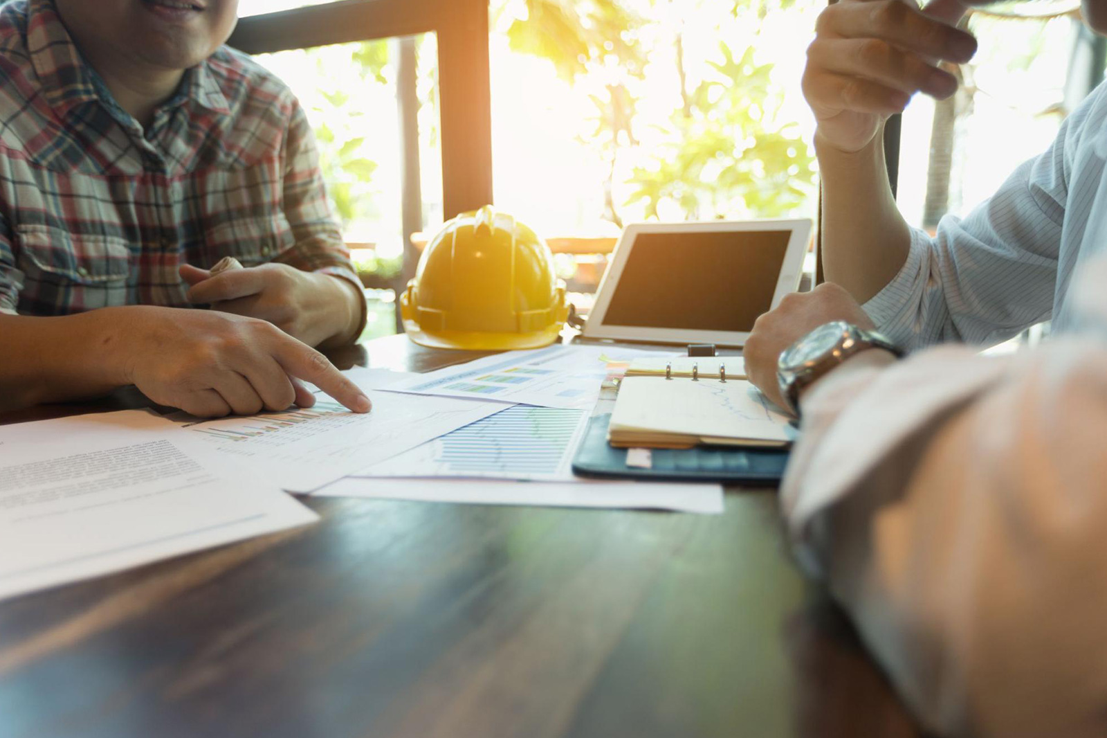 A project owner meeting a contractor to discuss contractor insurance coverage