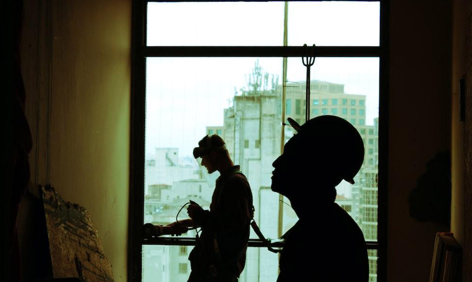 Workers inspecting commercial property water damage 