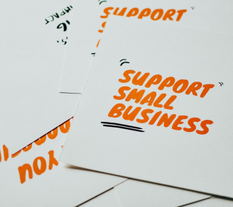 Posters with the words “support small businesses” written in the middle.