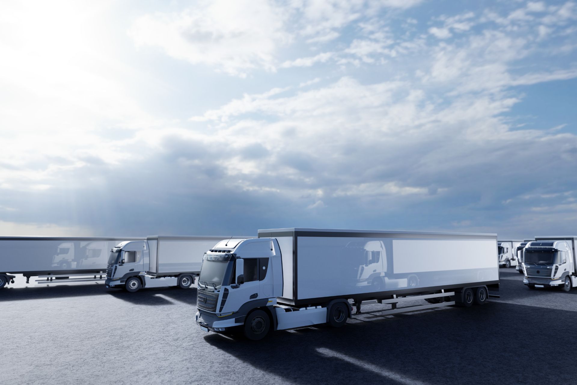 A fleet of trucks parked beside each other.