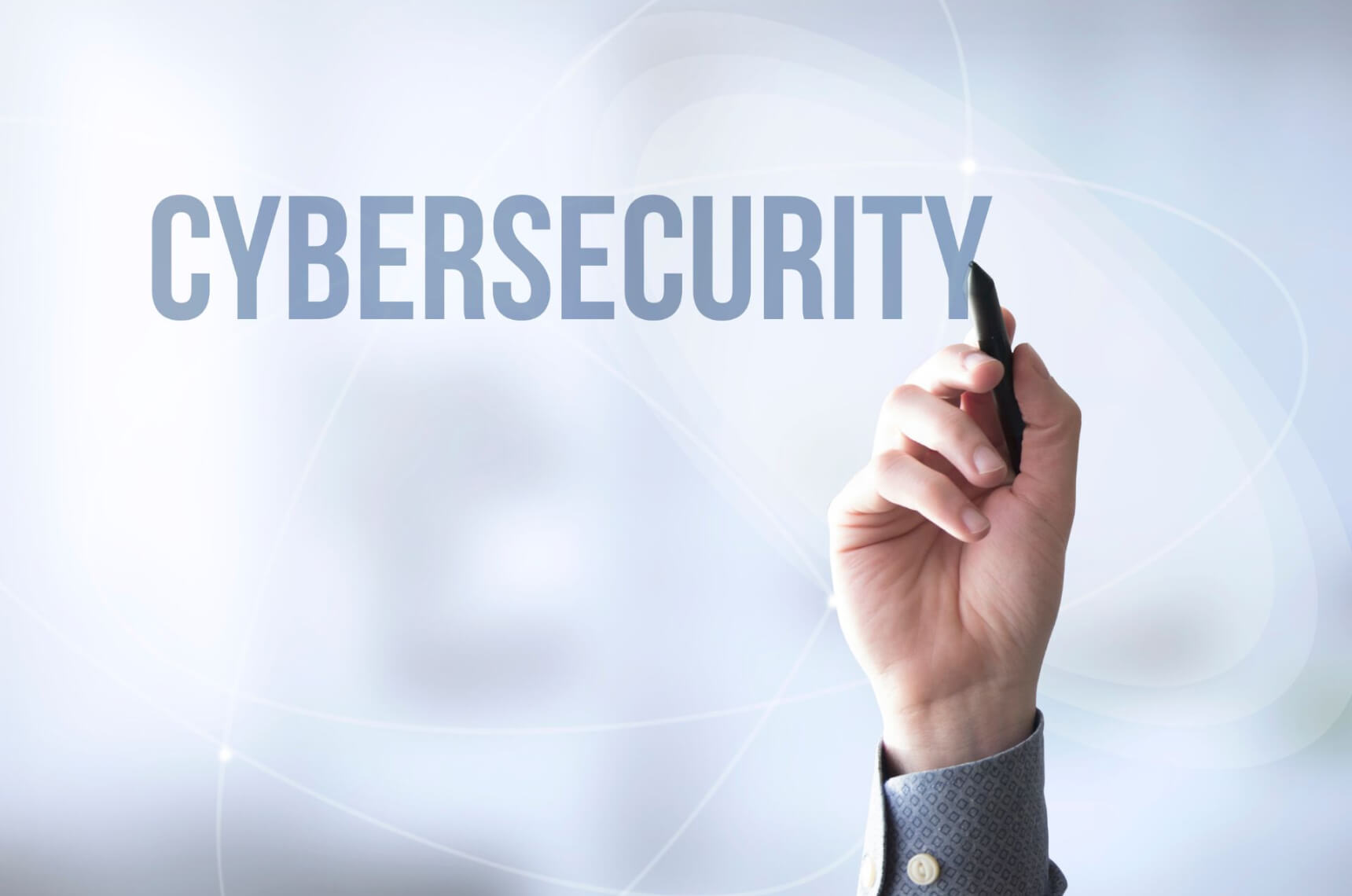  A person writing “Cybersecurity” in bold, capital letters
