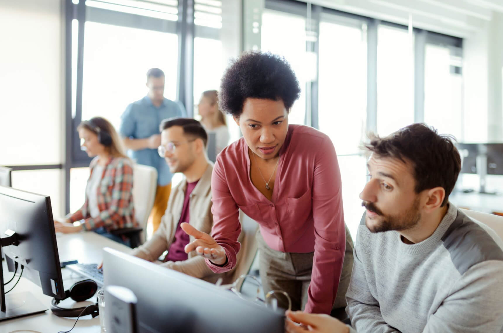 A manager explaining to an employee how to stay safe online.
