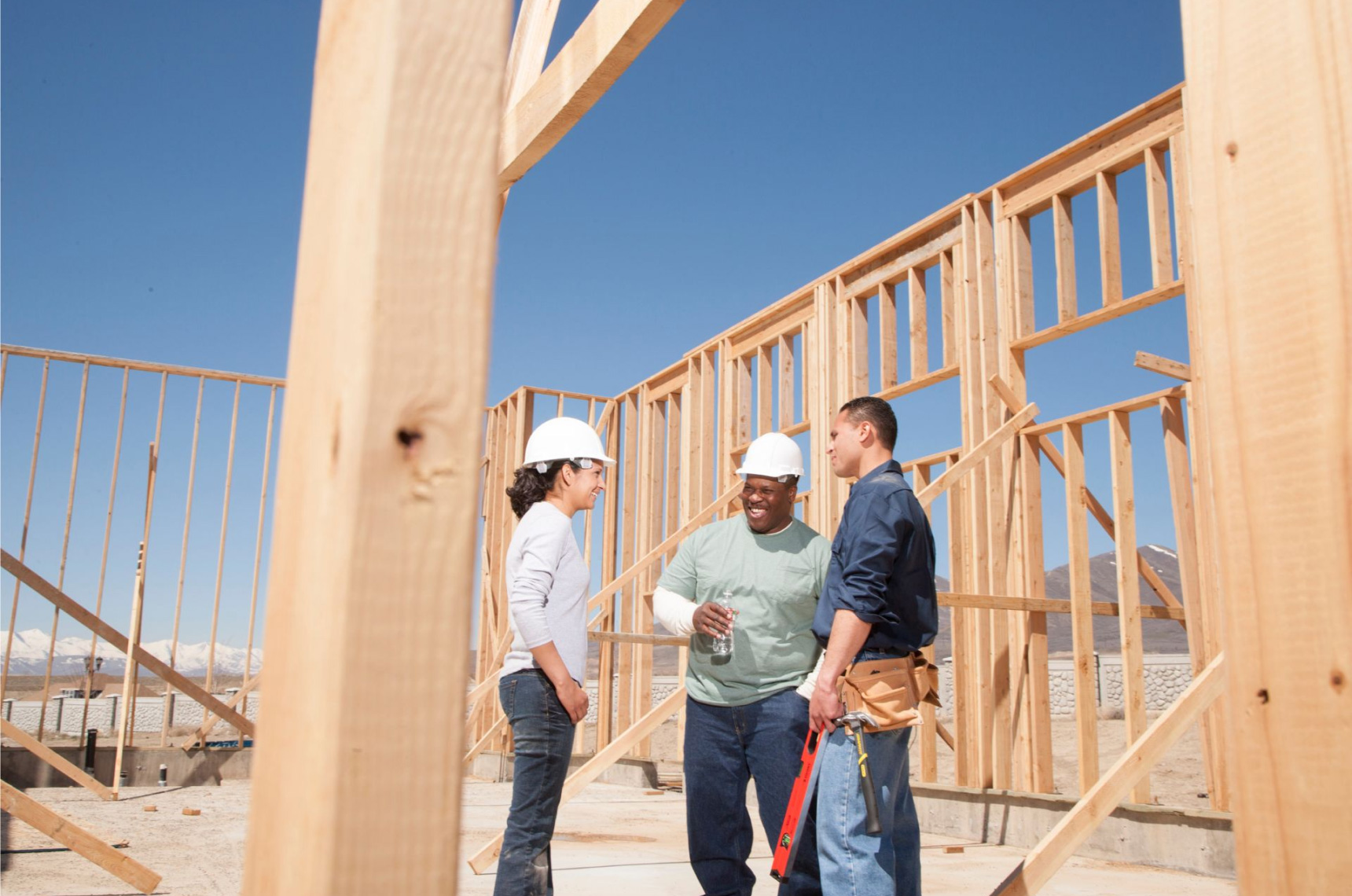Three home builders taking a break from working

