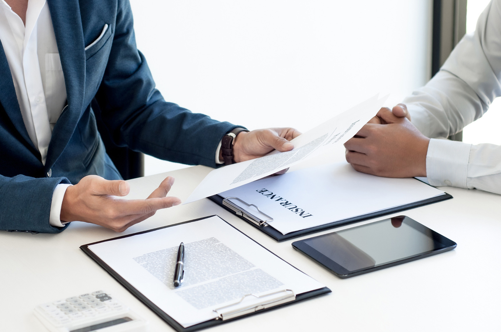 Tradesperson getting insured, about to sign a contract
