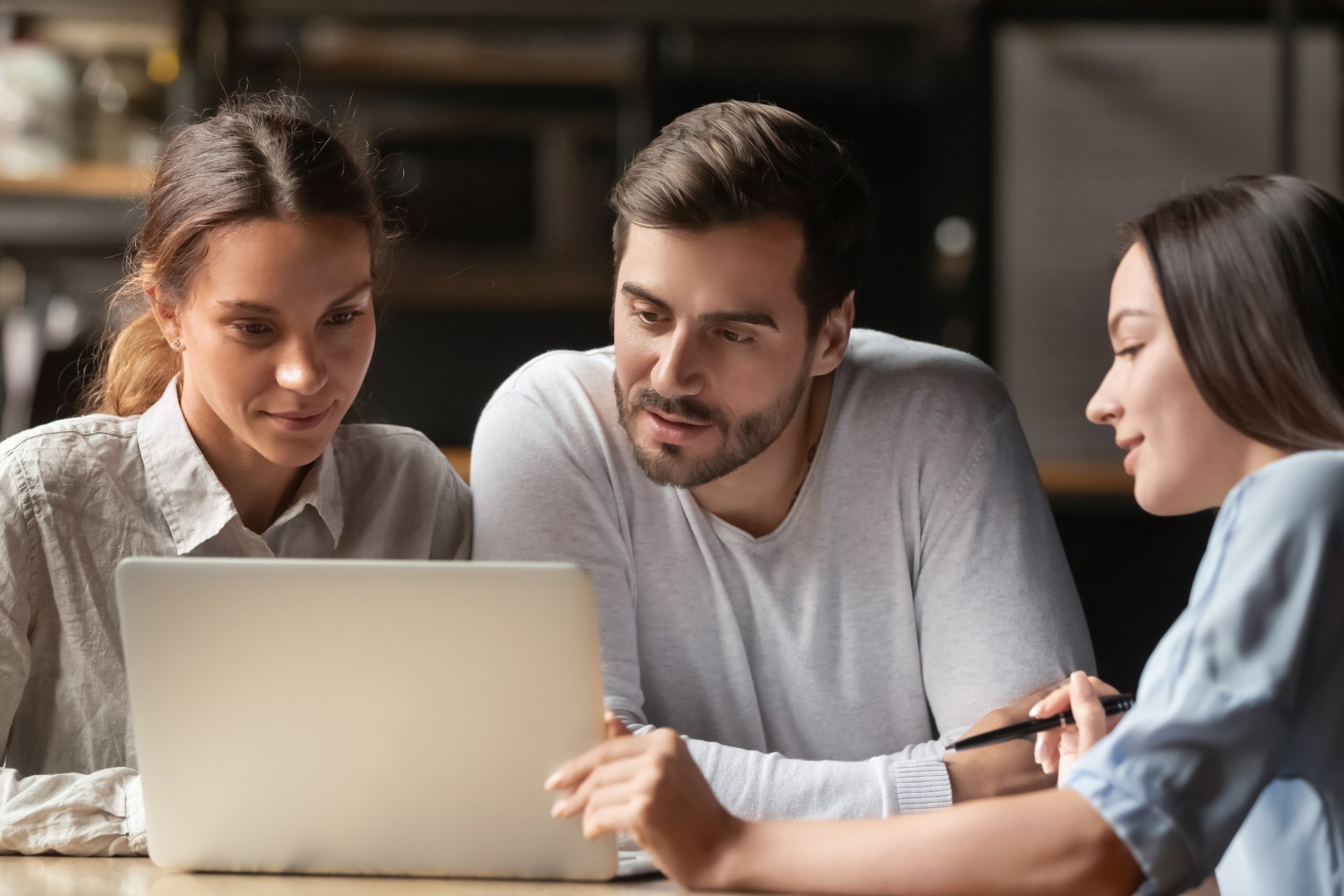 Business owners discussing strategic risk management with an insurance broker