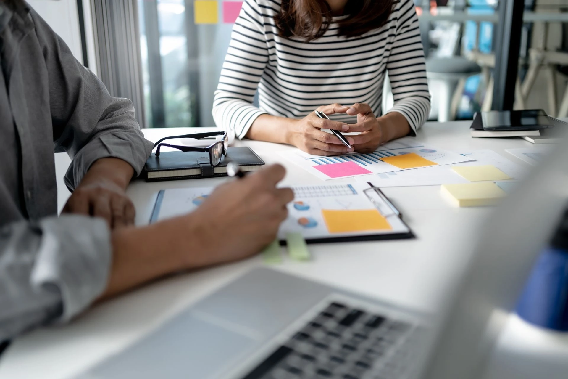 HR employees drafting an employee benefits package