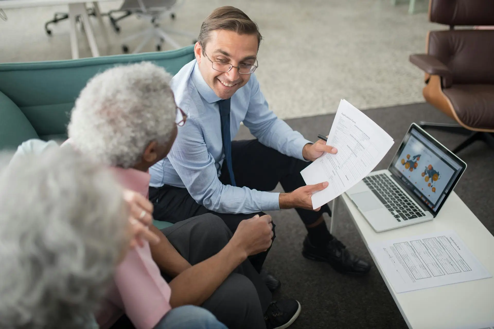 An agent explains commercial general liability insurance coverage to seniors