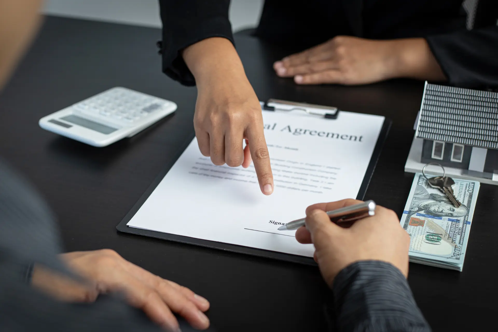 A business owner signing a commercial property insurance policy
