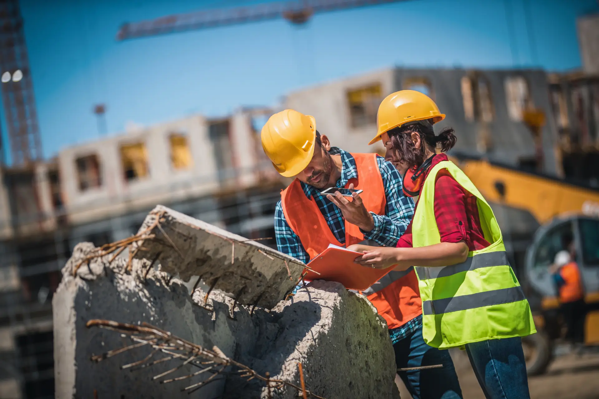 Contractors at a construction site inspecting waste