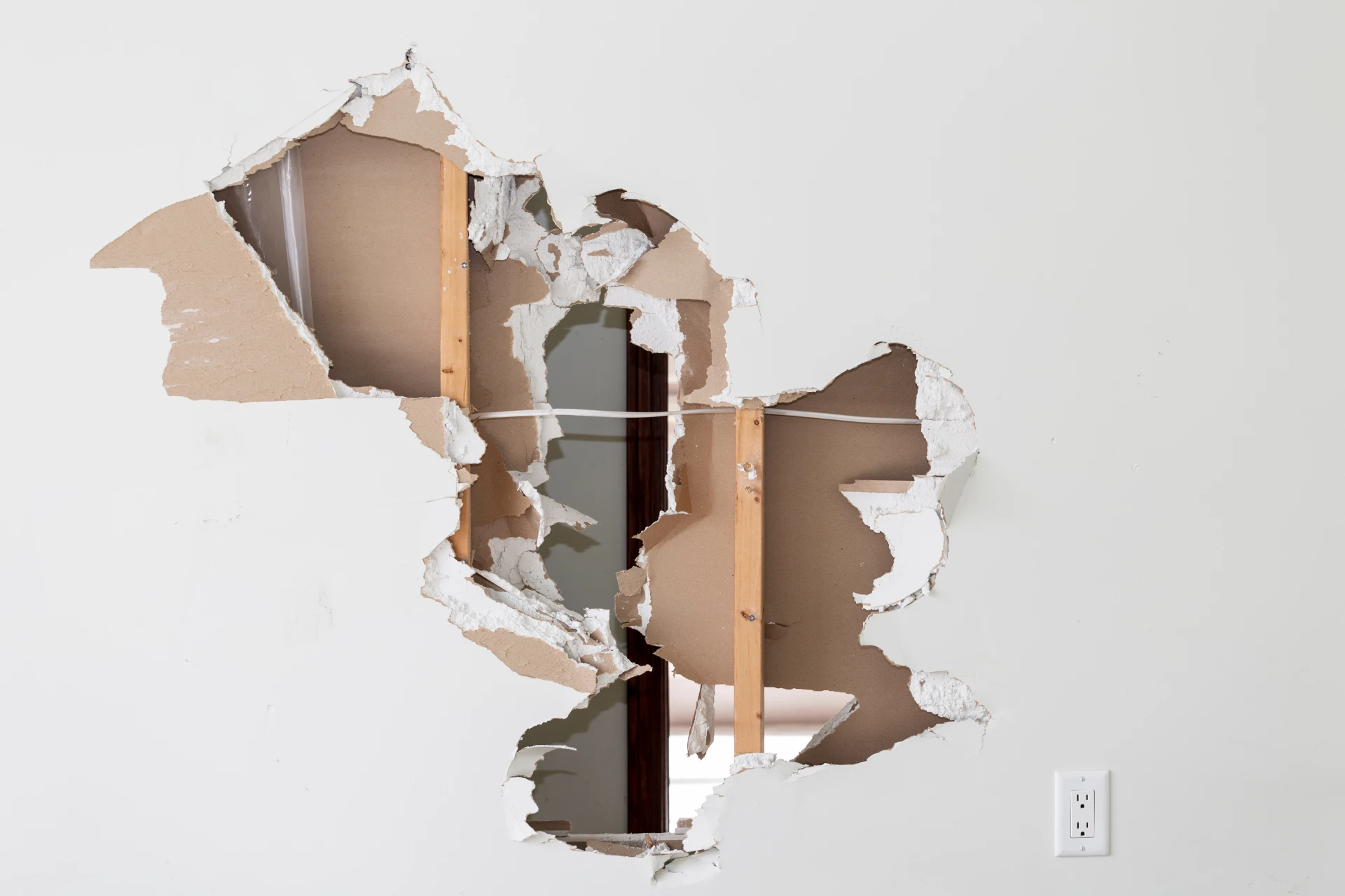 Damaged dry wall with holes
