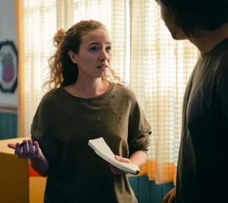 A female tenant talking to her landlord about papers