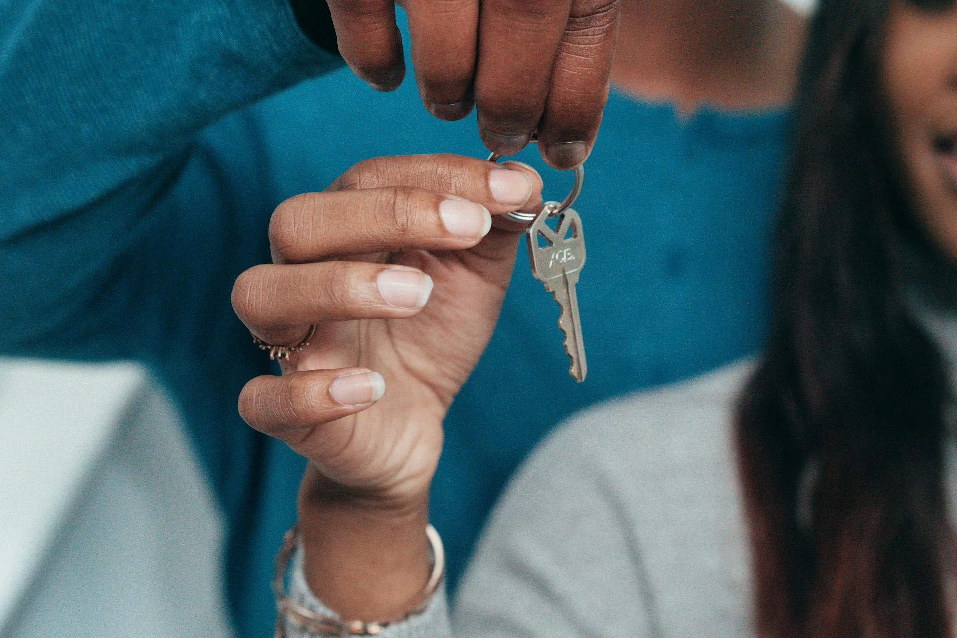 A couple holding a key to a rental place